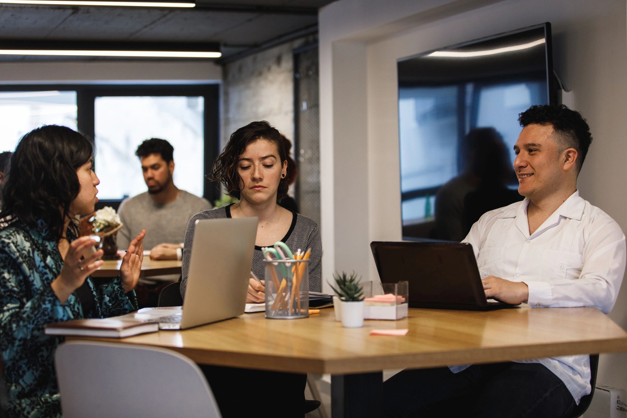 Office team discussing ideas at a table