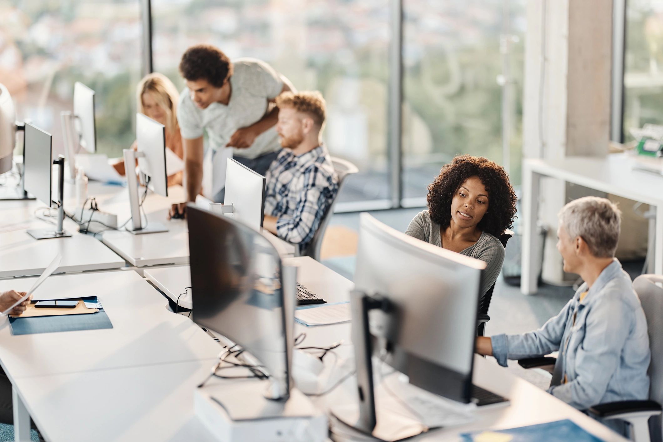 Programmers collaborating in a modern office