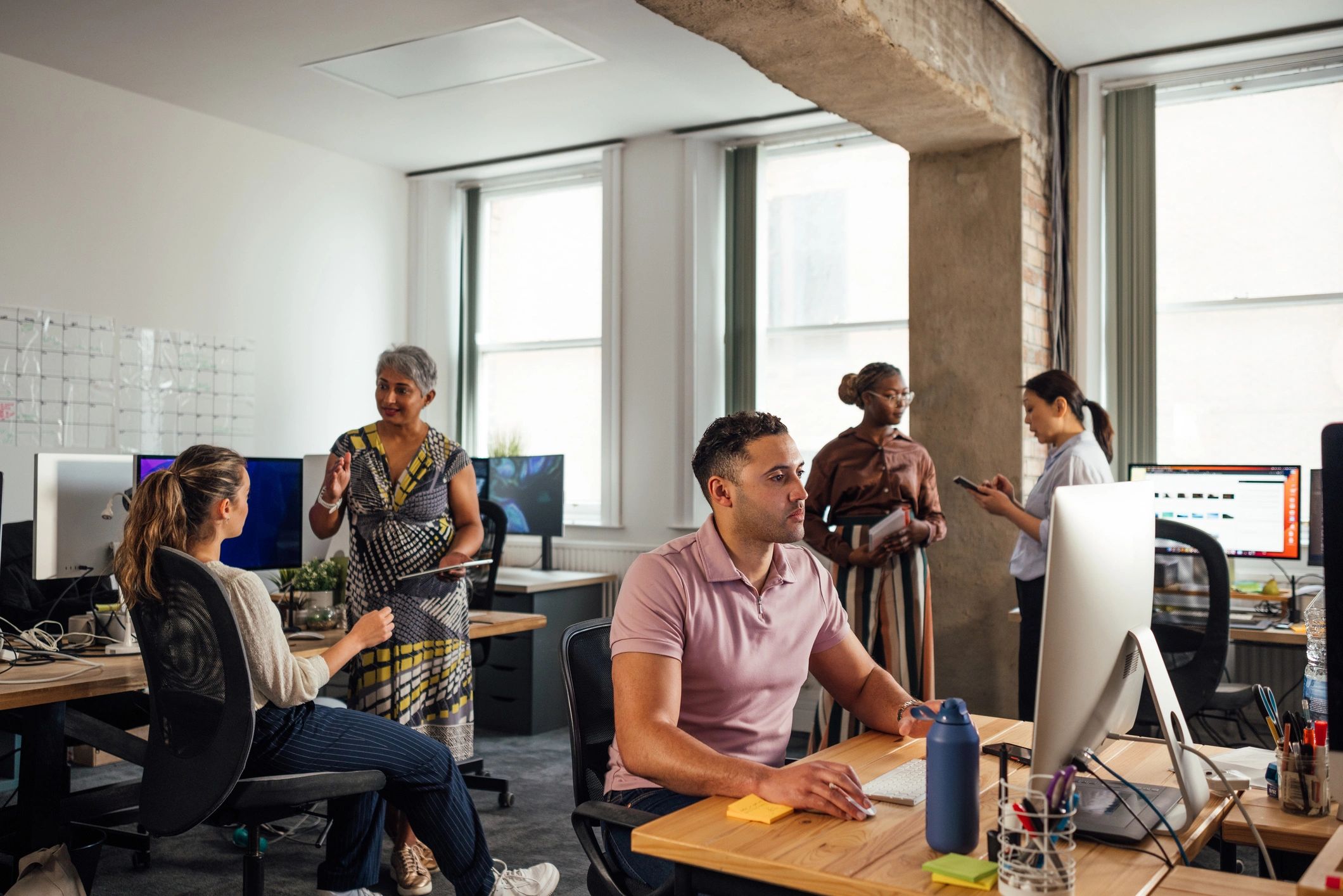 Colleagues collaborating in a modern office