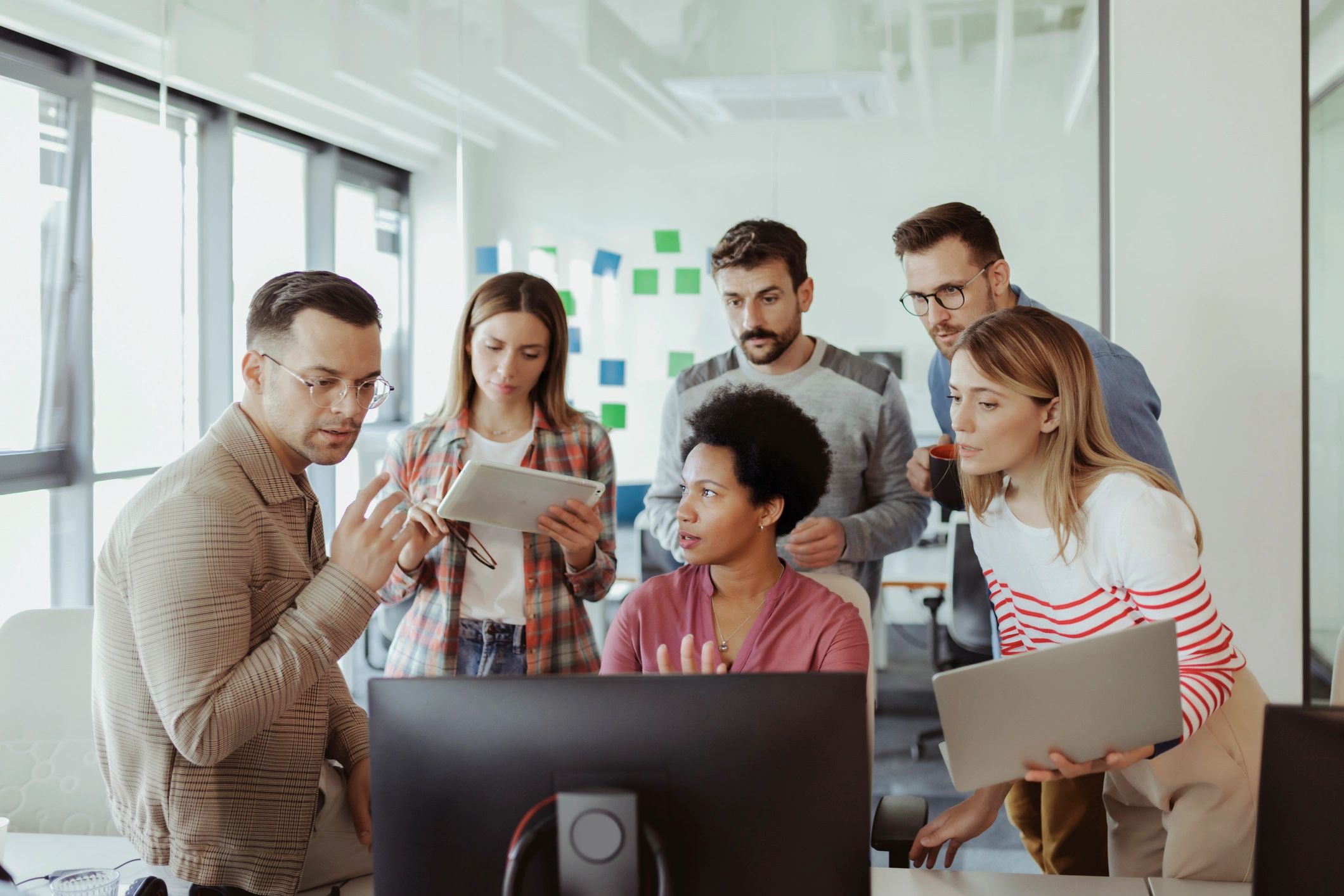 Developers collaborating in a bright office