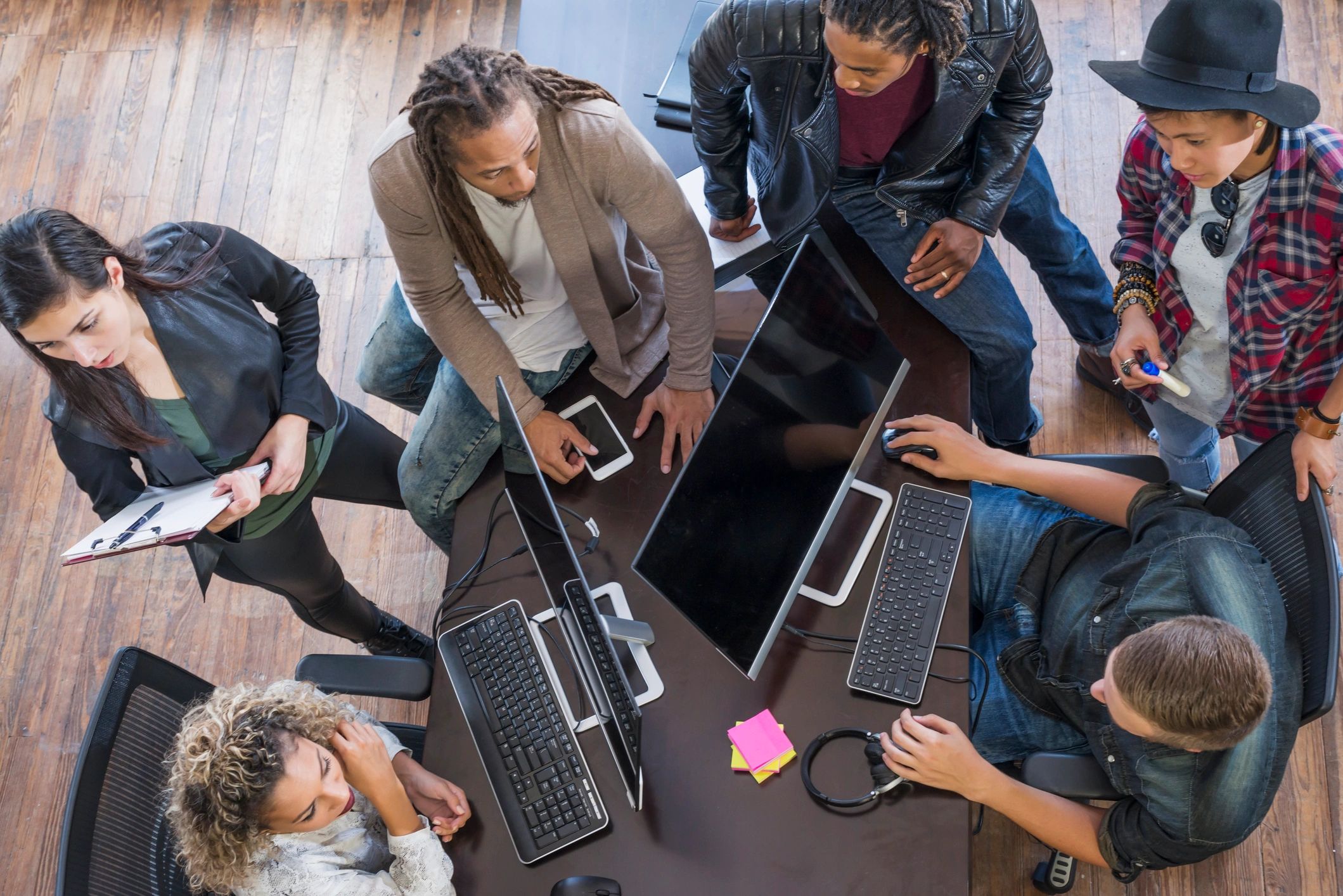 Multi-ethnic group brainstorming in a meeting